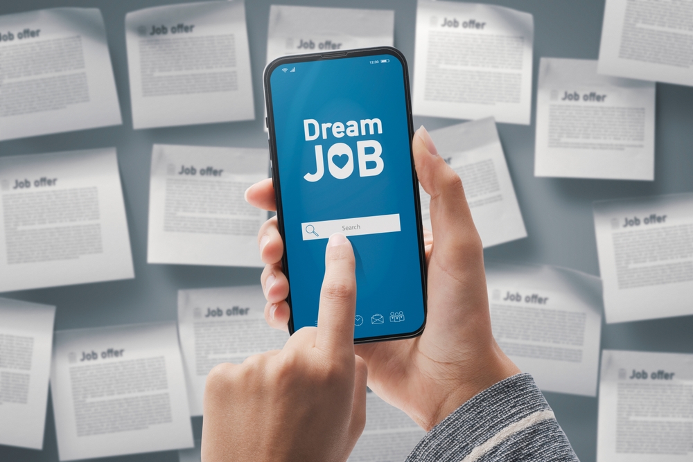 Job hunter looking for their dream job on their mobile device encounters an employment scam.